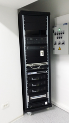 Rack cabinet with equipment